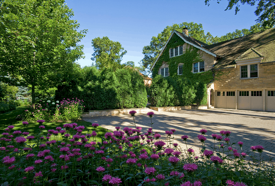 stone paver driveway stone paver driveway with purple flowers in the foreground