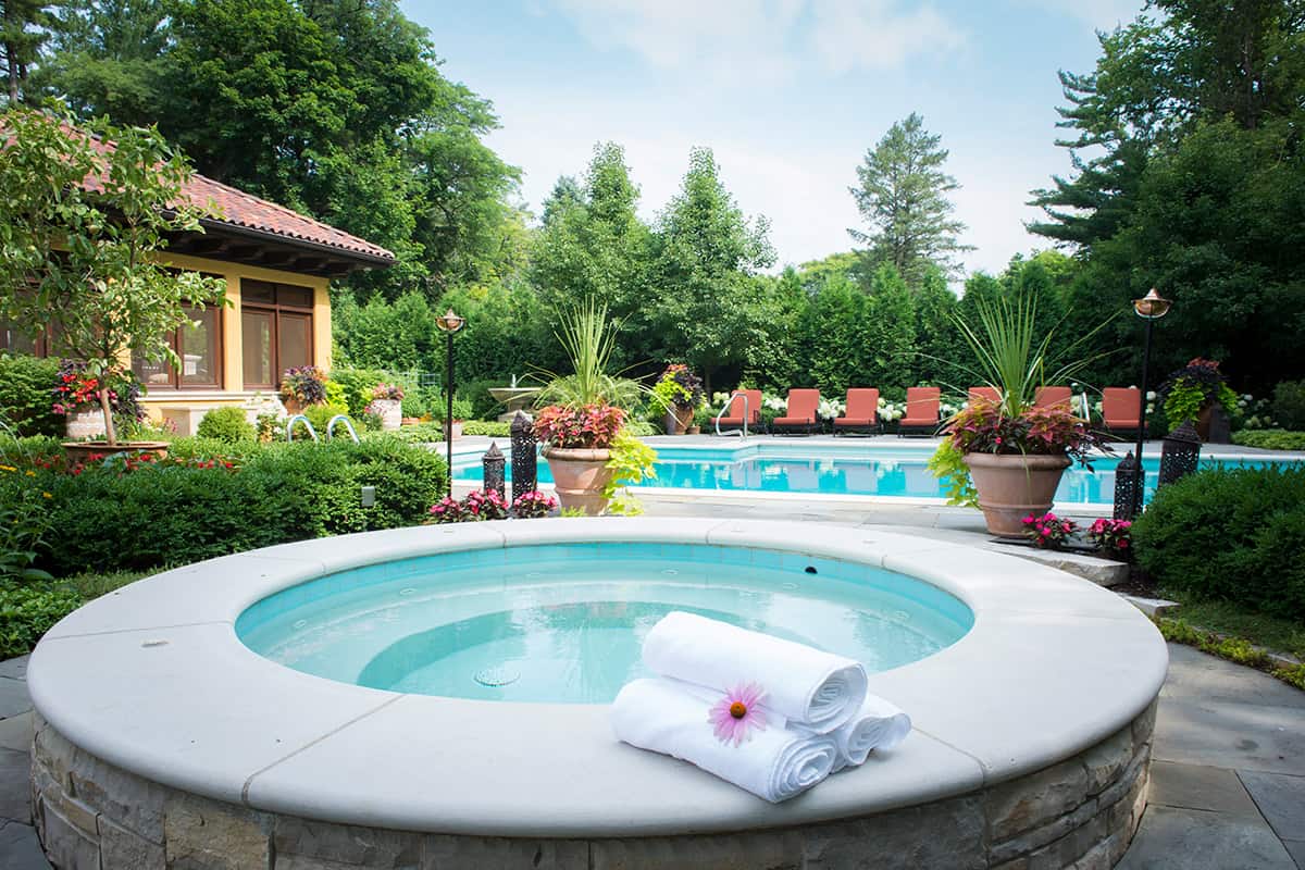 raised-lannon-stone-spa-and-pool-glenview-il raised lannon stone spa with smooth concrete coping