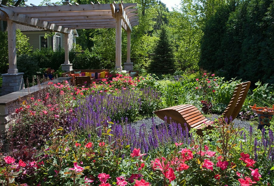 wood-slatted-lounge-chair-surrounded-by-flowers wood-slatted-lounge-chair-surrounded-by-flowers