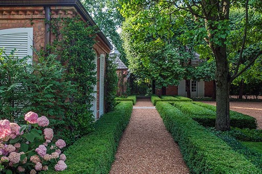 decomposed granite path with boxwood hedges