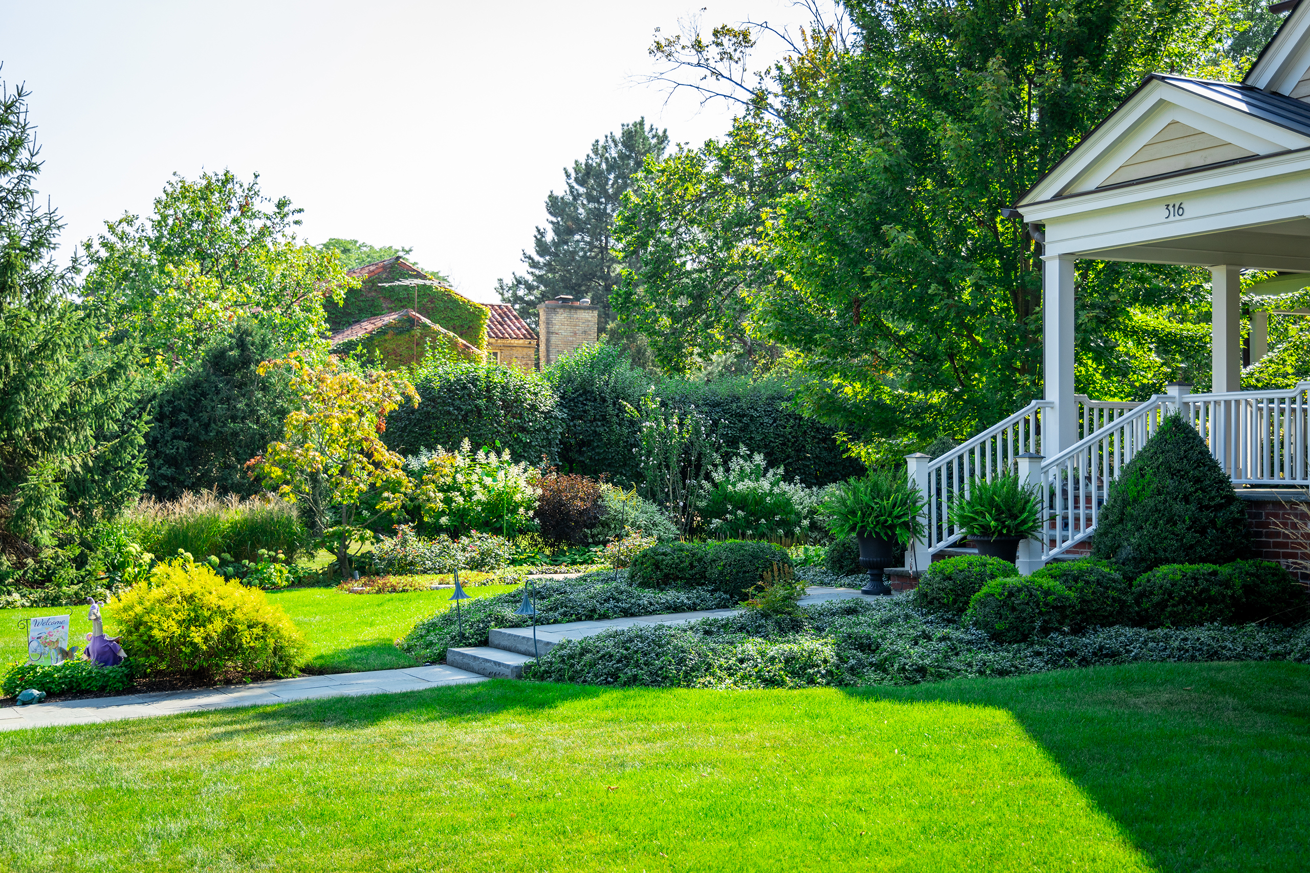 curved beds at front entry